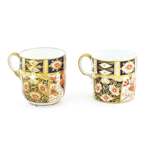 116A - A Royal Crown Derby coffee cup and saucer decorated in the Imari pattern. Marked under no. 2451. Tog... 