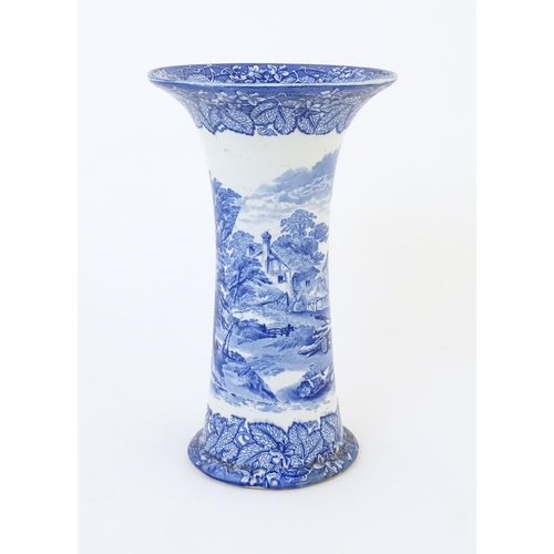 151A - A Masons blue and white vase of flared cylindrical form decorated with a country / farm landscape. W... 