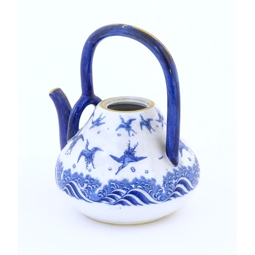 146A - A Minton teapot decorated in the pattern Japanese Crane, designed by Christopher Dresser, with crane... 