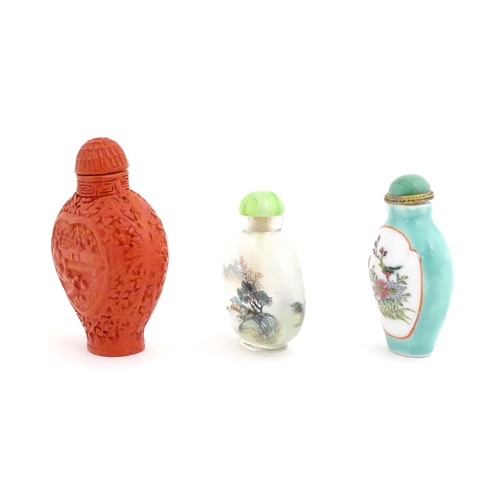 1004 - Three Chinese snuff bottles to include a glass example with hand painted landscape detail. Largest a... 