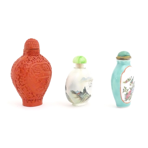 1004 - Three Chinese snuff bottles to include a glass example with hand painted landscape detail. Largest a... 