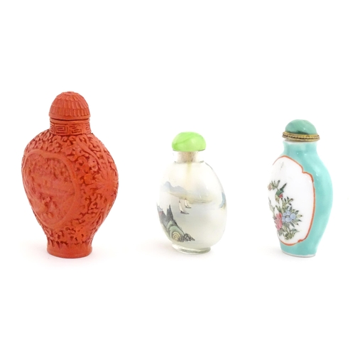 1004 - Three Chinese snuff bottles to include a glass example with hand painted landscape detail. Largest a... 