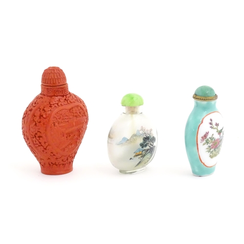 1004 - Three Chinese snuff bottles to include a glass example with hand painted landscape detail. Largest a... 