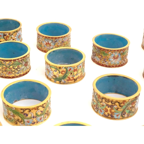 1005 - A quantity of assorted Chinese enamel / cloisonne napkin rings with floral and foliate decoration (2... 