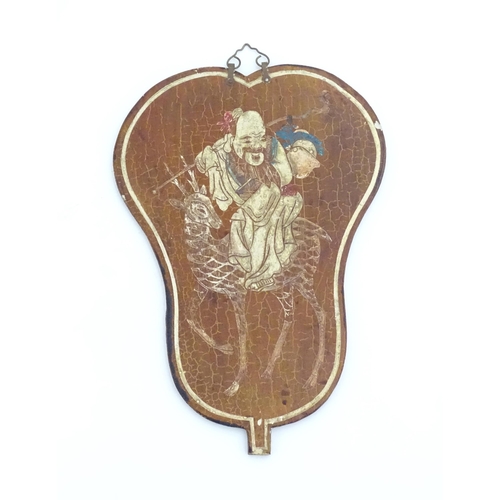 1010 - Three Oriental wall plaques of fan form each depicting a figure. Largest approx. 12 1/4