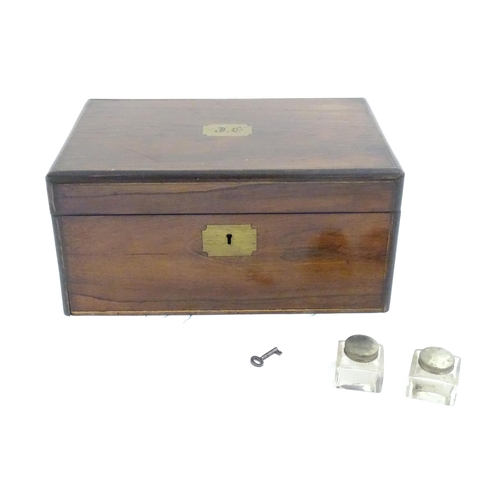 1016 - A Victorian walnut writing slope / box with brass banding and fitted interior. Approx. 6 1/2