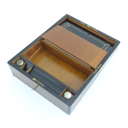 1016 - A Victorian walnut writing slope / box with brass banding and fitted interior. Approx. 6 1/2