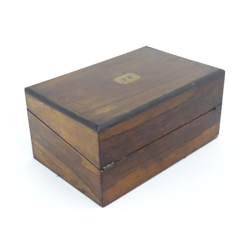 1016 - A Victorian walnut writing slope / box with brass banding and fitted interior. Approx. 6 1/2