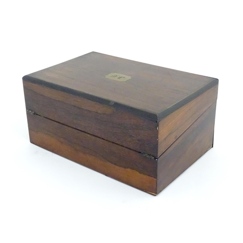 1016 - A Victorian walnut writing slope / box with brass banding and fitted interior. Approx. 6 1/2