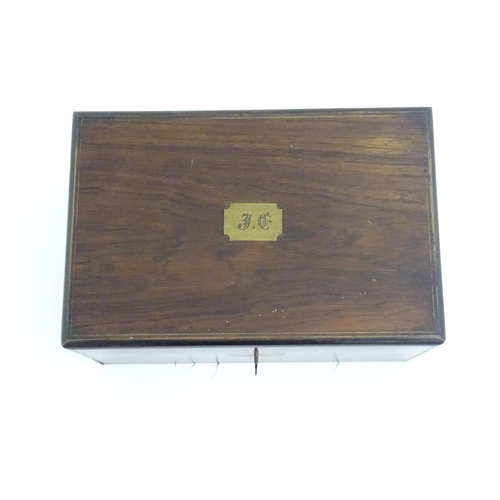 1016 - A Victorian walnut writing slope / box with brass banding and fitted interior. Approx. 6 1/2