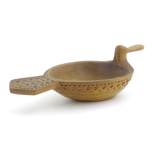 1024 - A Scandinavian folk art treen bowl / ale / grain measure modelled as a duck with banded geometric ch... 