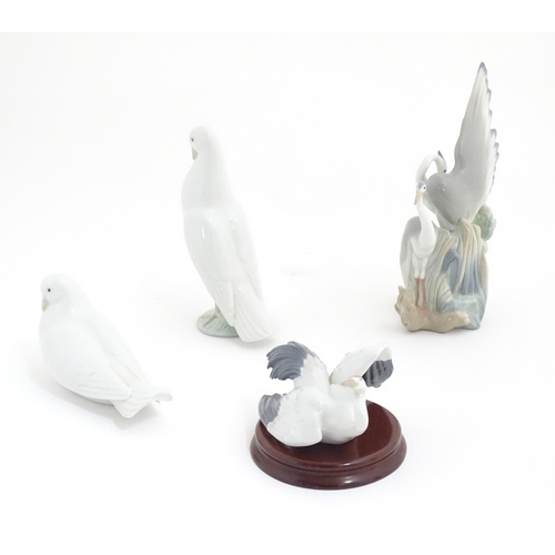 132 - Three Nao models of birds comprising Resting Herons, and two doves. Together with a Lladro Flutterin... 