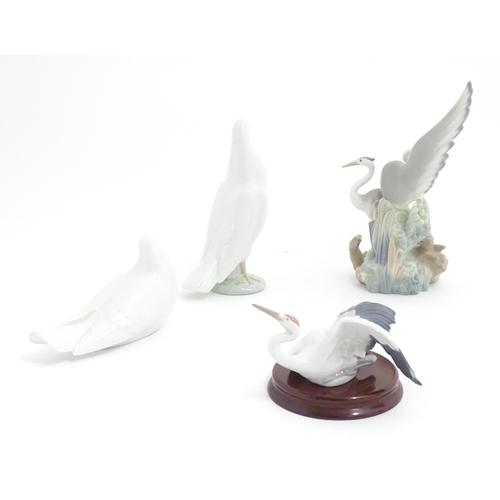 132 - Three Nao models of birds comprising Resting Herons, and two doves. Together with a Lladro Flutterin... 