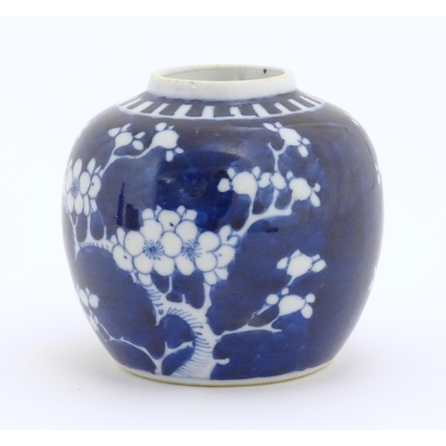 29A - A Chinese blue and white jar decorated with blossom flowers. Ring mark under. Approx. 3 3/4