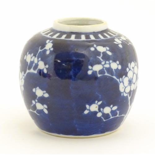 29A - A Chinese blue and white jar decorated with blossom flowers. Ring mark under. Approx. 3 3/4