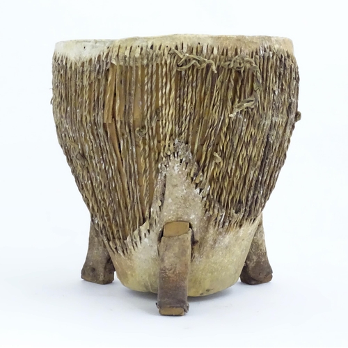 1045 - Ethnographic / Native / Tribal: An African animal hide drum raised on three legs. Approx. 14 1/4