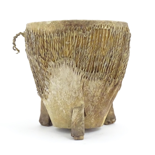 1045 - Ethnographic / Native / Tribal: An African animal hide drum raised on three legs. Approx. 14 1/4