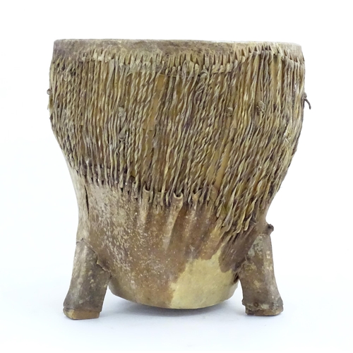 1045 - Ethnographic / Native / Tribal: An African animal hide drum raised on three legs. Approx. 14 1/4