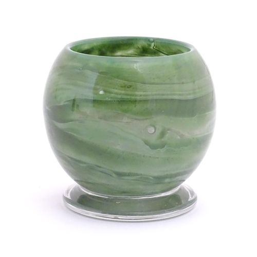 155 - An Art Deco Art Glass bowl with green swirled detail and circular foot. Approx 4