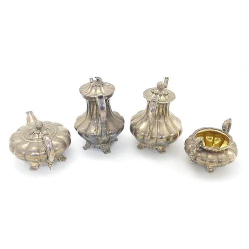 549 - A 19thC silver plate matched four piece tea set comprising teapot, coffee pot, hot water jug and sug... 