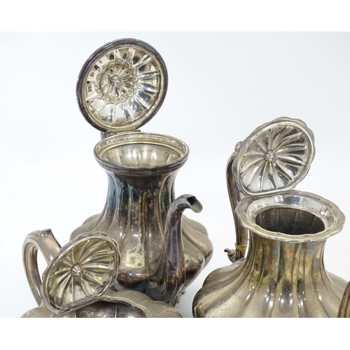 549 - A 19thC silver plate matched four piece tea set comprising teapot, coffee pot, hot water jug and sug... 