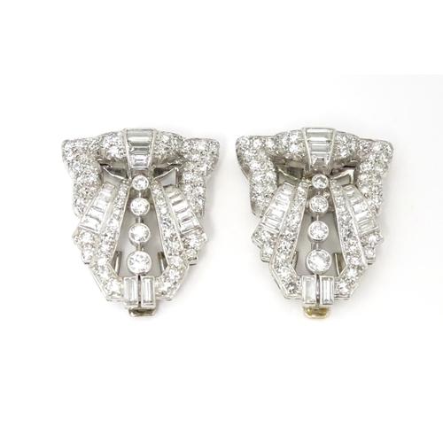 768 - A pair of Art Deco white metal collar clips set with a profusion of diamonds. Each approx. 1