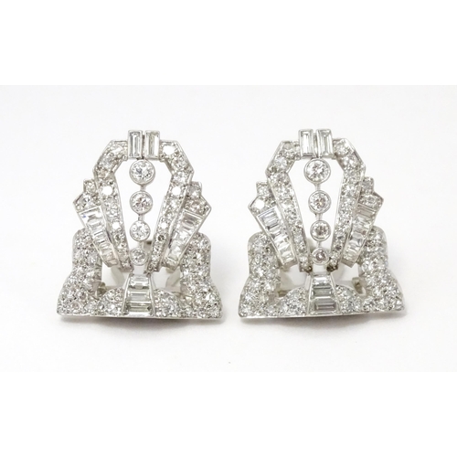 768 - A pair of Art Deco white metal collar clips set with a profusion of diamonds. Each approx. 1