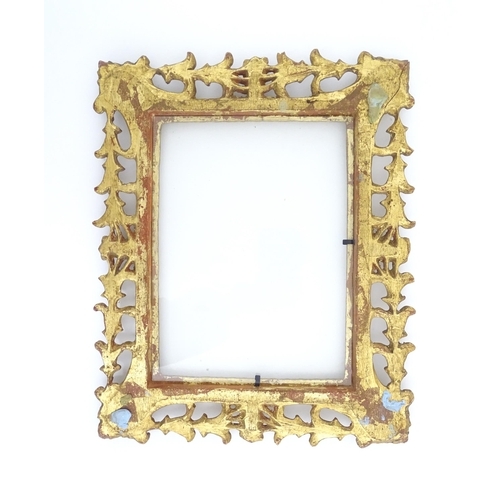 968 - A 20thC Florentine style pierced giltwood frame. Approx. 13 1/2