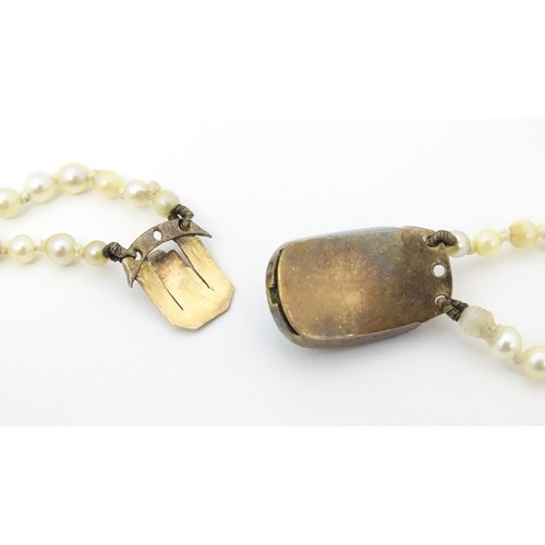 730 - A two strand graduated pearl necklace with yellow metal clasp set with agate and seed pearls. Approx... 