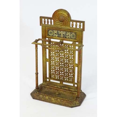 1454 - A late 19thC Aesthetic movement stick stand in the manner of Thomas Jeckyll, the segmental top decor... 