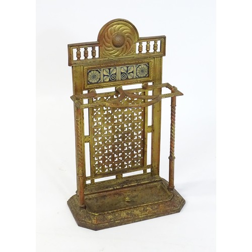 1454 - A late 19thC Aesthetic movement stick stand in the manner of Thomas Jeckyll, the segmental top decor... 