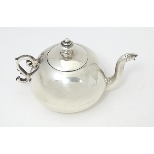 302 - A .925 silver miniature model of a teapot. Approx. 2 1/4