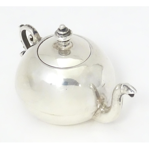 302 - A .925 silver miniature model of a teapot. Approx. 2 1/4