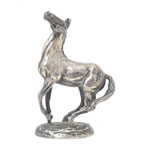 371 - A silver model of a horse 'Playing Up', after Lorne McKean, hallmarked London 1975, maker John Pinch... 