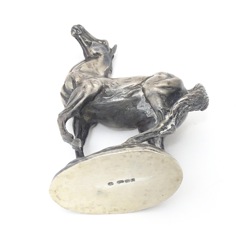 371 - A silver model of a horse 'Playing Up', after Lorne McKean, hallmarked London 1975, maker John Pinch... 