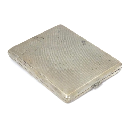 379 - A Continental .835 silver cigarette case with engine turned decoration and gilded interior. Approx. ... 