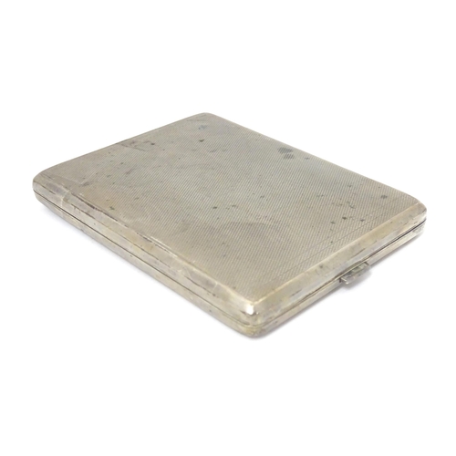 379 - A Continental .835 silver cigarette case with engine turned decoration and gilded interior. Approx. ... 