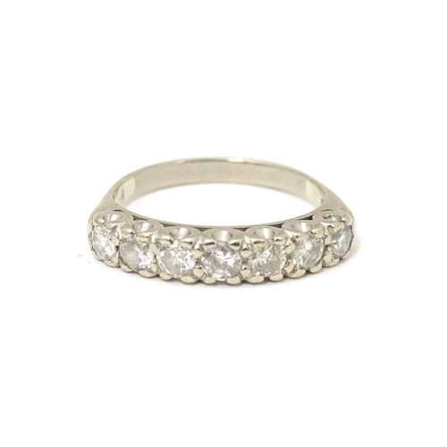 622 - An 18ct white gold half eternity ring set with seven diamonds in a linear setting. Ring size approx.... 