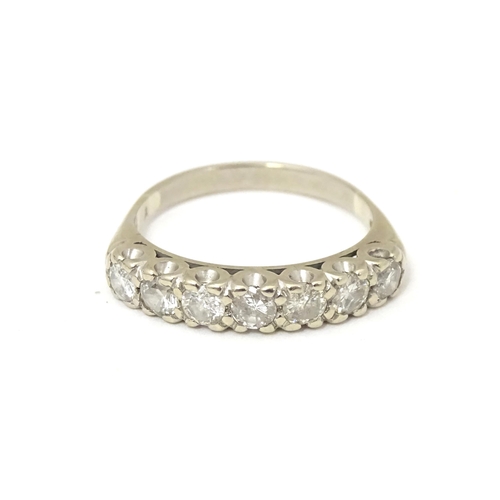 622 - An 18ct white gold half eternity ring set with seven diamonds in a linear setting. Ring size approx.... 