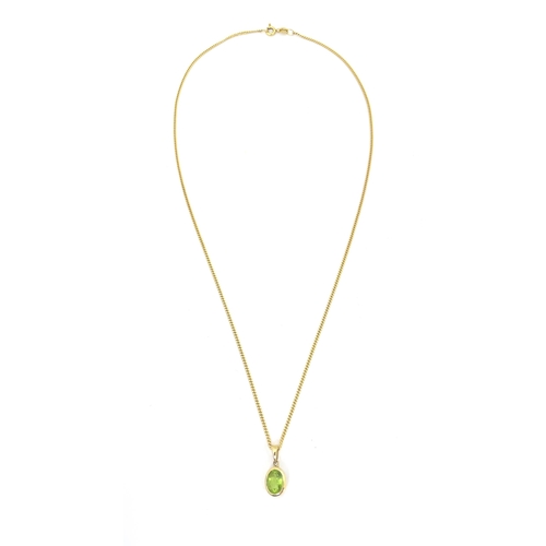 726 - A 9ct gold pendent set with peridot on a 9ct gold chain necklace. The chain 18