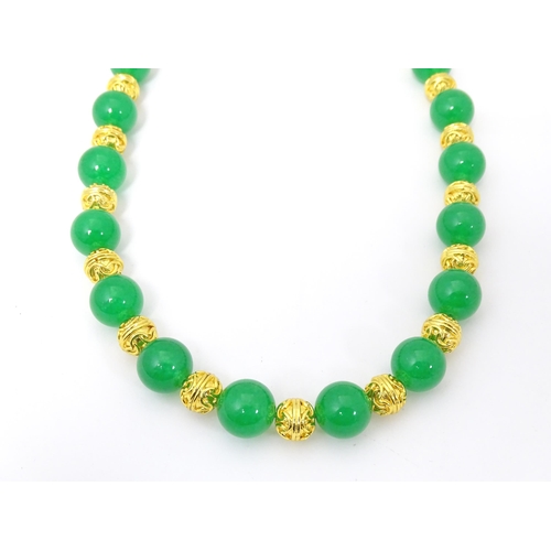 763 - Assorted jade jewellery to include bead necklace and earrings and two bangles.