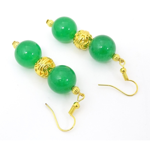 763 - Assorted jade jewellery to include bead necklace and earrings and two bangles.