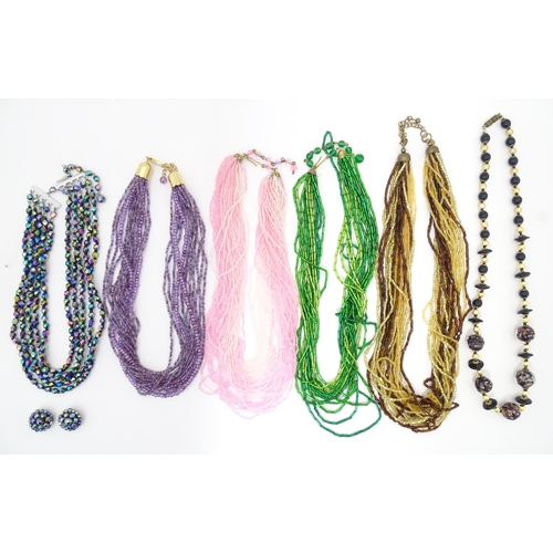 764 - Assorted jewellery to include various bead necklaces together with a pair of earrings