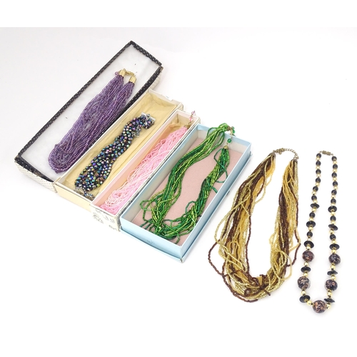 764 - Assorted jewellery to include various bead necklaces together with a pair of earrings