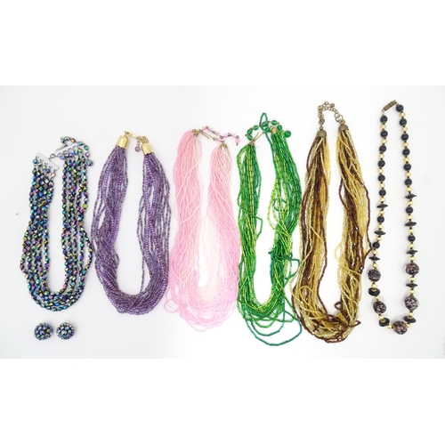 764 - Assorted jewellery to include various bead necklaces together with a pair of earrings