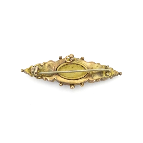 670A - A 9ct Victorian gold brooch set with central diamond. Hallmarked Birmingham 1899. 2