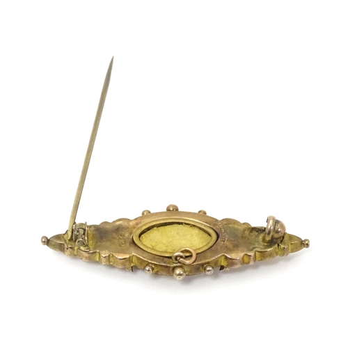 670A - A 9ct Victorian gold brooch set with central diamond. Hallmarked Birmingham 1899. 2