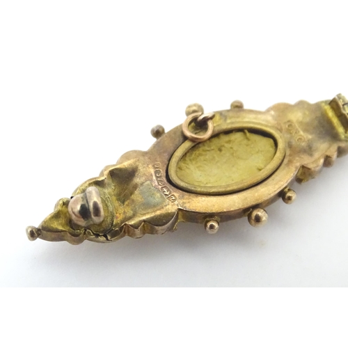 670A - A 9ct Victorian gold brooch set with central diamond. Hallmarked Birmingham 1899. 2