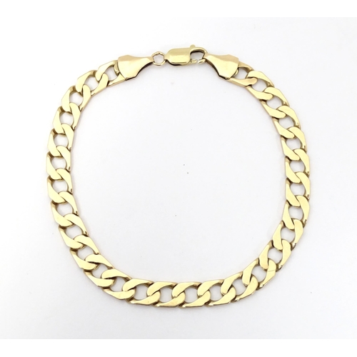 751A - A 9ct gold gents bracelet. Approx. 9