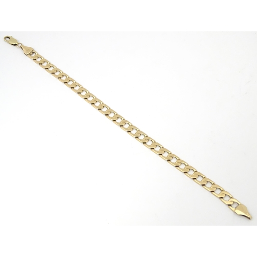 751A - A 9ct gold gents bracelet. Approx. 9